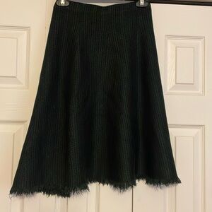 Cabi, tag taken out, green and black houndstooth skirt with fringe.